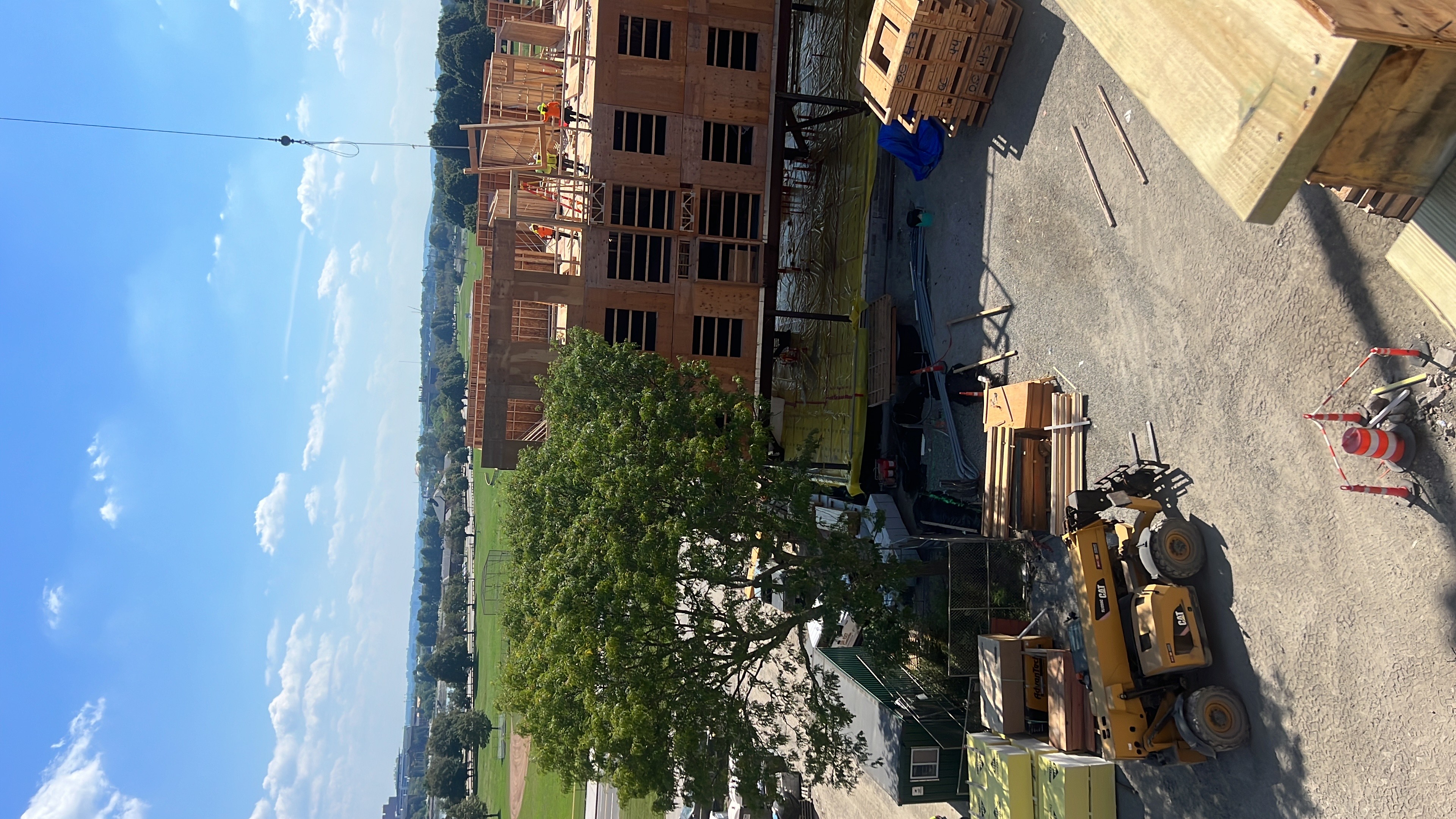 Aerial View - Multi-Story Wood Frame Construction with Equipment