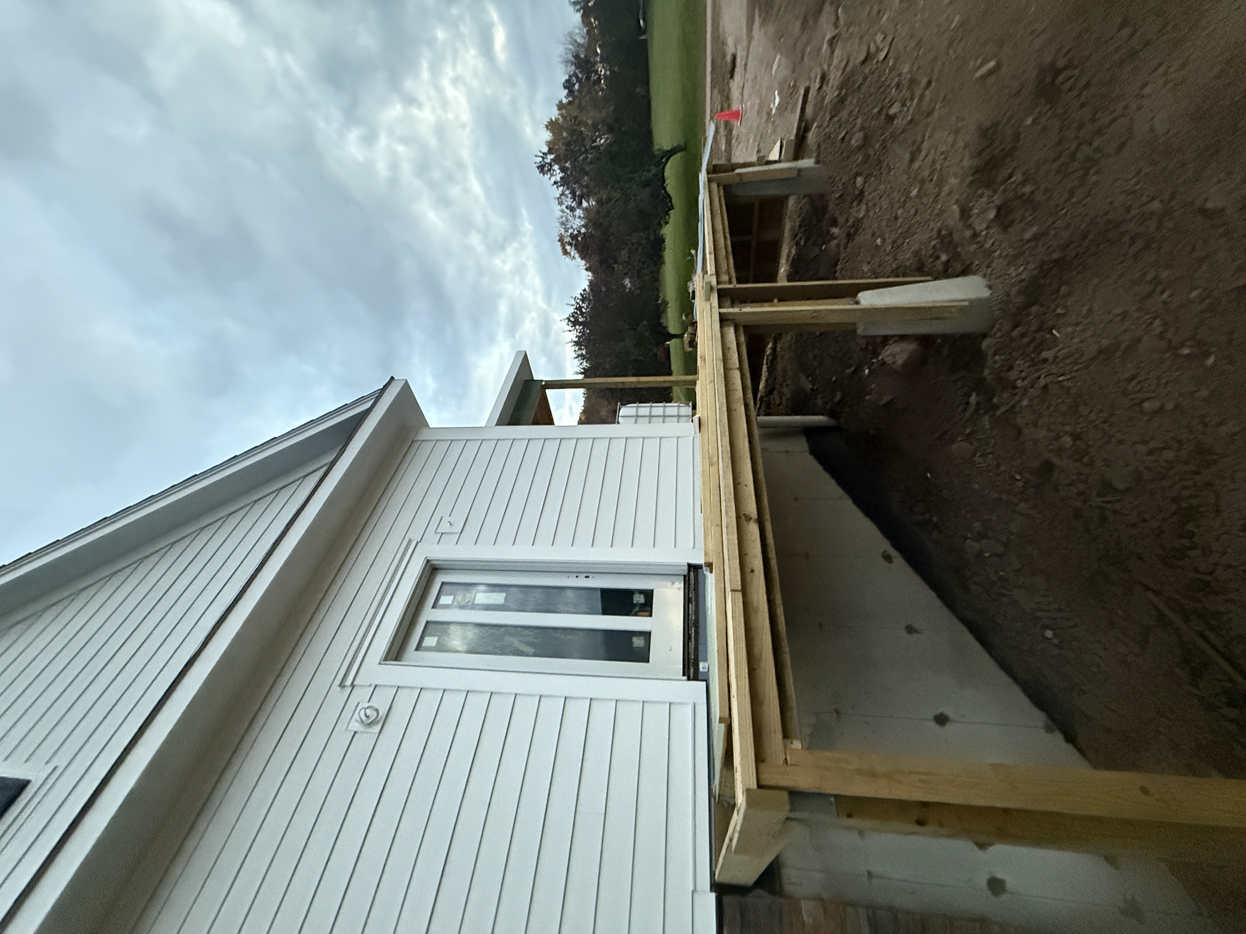 Early Deck Framing Stage - Joist Installation on Foundation