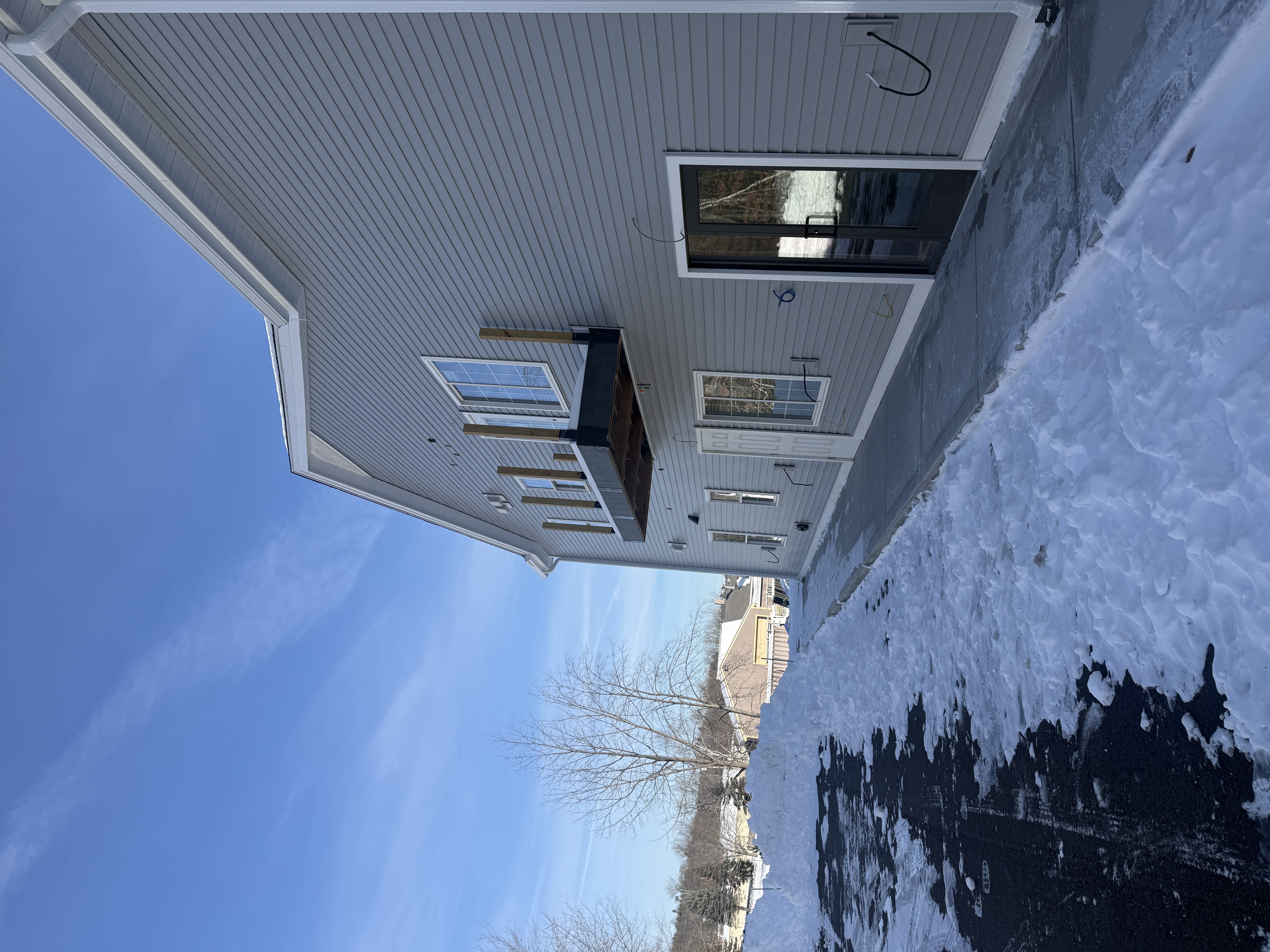 Exterior Addition with Deck - Modern Siding and Glass Doors